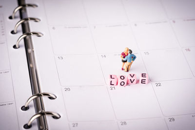 High angle view of information sign on tiled floor