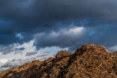 Low angle view of rocks against sky