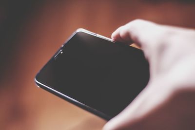 Close-up of person using mobile phone