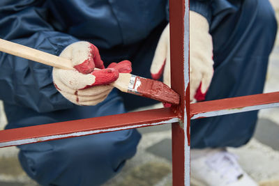 Close-up of man working on wood