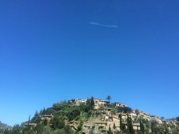 Buildings against blue sky and clouds