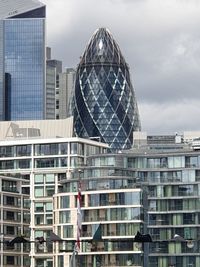 Modern building against cloudy sky