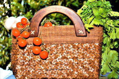 Close-up of fruits hanging on wood