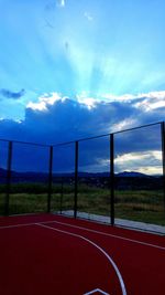 Empty road against cloudy sky