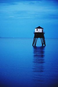 Scenic view of sea against blue sky