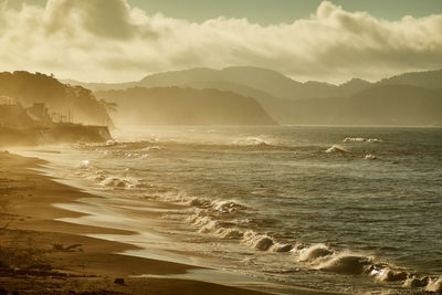 Scenic view of sea against sky during sunrise