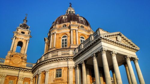 Low angle view of church against clear blue sky