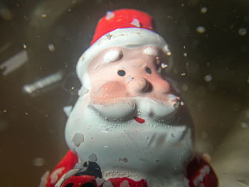 Close-up of child on glass