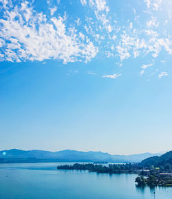 Scenic view of sea against blue sky