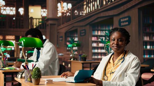 Portrait of young woman sitting at restaurant