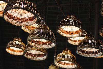 Low angle view of illuminated lighting equipment