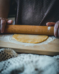 Midsection of person preparing food on table