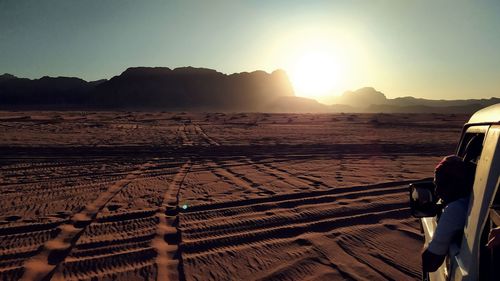 Scenic view of land against sky during sunset