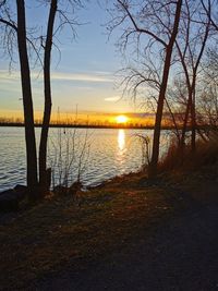 Scenic view of lake against sky during sunset