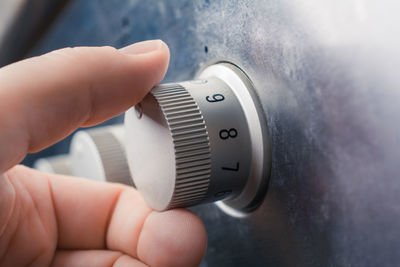 Close-up of hand holding camera