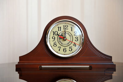 Close-up of clock on wood