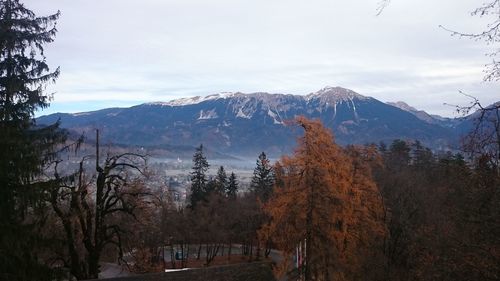 Scenic view of mountains against cloudy sky