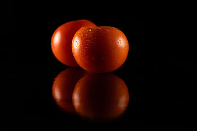 Close-up of apple against black background