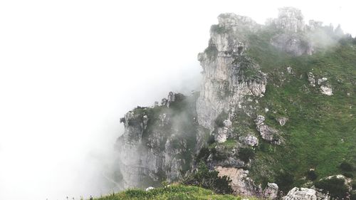 Scenic view of waterfall against sky