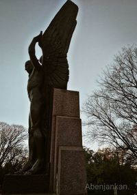 Low angle view of statue against sky