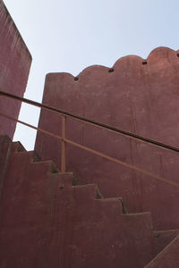 Low angle view of wall against sky