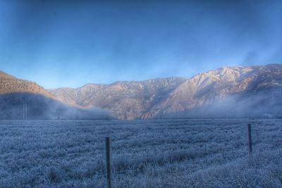 Scenic view of mountains against sky during winter