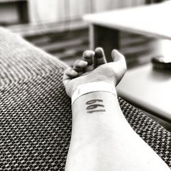 Close-up of hand on railing