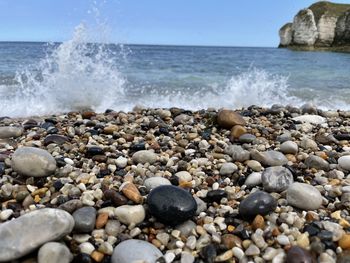 Waves splashing on rocks at shore