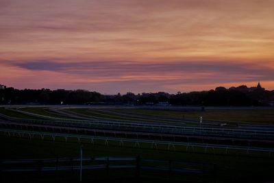 Royal randwick racecourse against dramatic sky during sunset