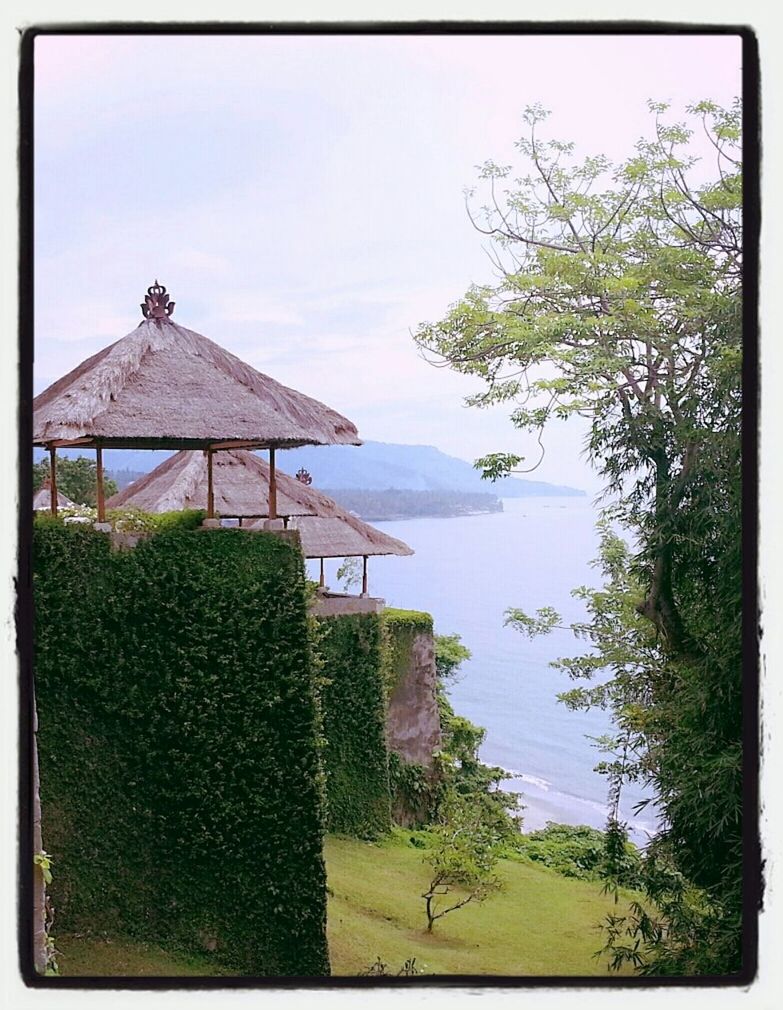 building exterior, built structure, architecture, water, sky, transfer print, tree, house, grass, tranquil scene, auto post production filter, lake, nature, tranquility, religion, scenics, plant, green color, day, place of worship