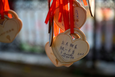 Close-up of love padlocks hanging on heart shape