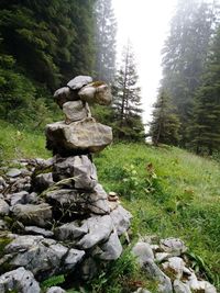 Stone wall on mountain against sky