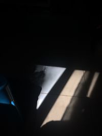 Close-up of shadow on tiled floor