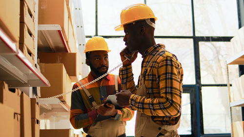 Rear view of man working at construction site