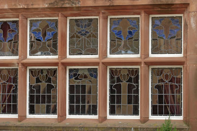 Low angle view of glass window of building