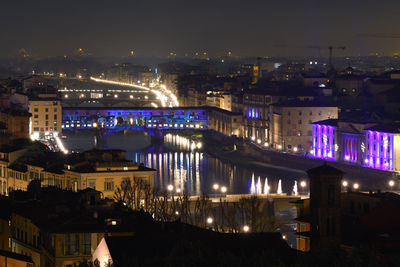 High angle view of illuminated buildings in city at night