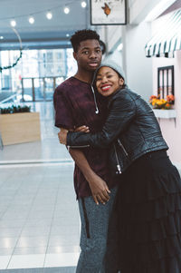 Portrait of young couple kissing