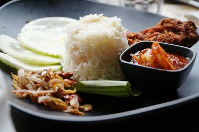 Close-up of served foods in plate