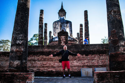 Full length of a statue against temple