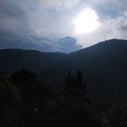 Scenic view of silhouette mountains against sky