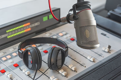 Professional microphone and headphones in radio studio