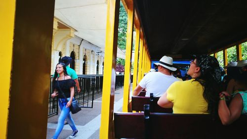 People in yellow shopping cart