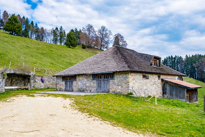 House on field against sky