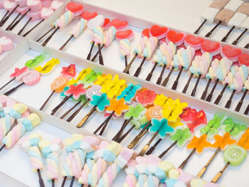 High angle view of multi colored candies on table