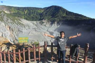 Full length of man standing on mountain