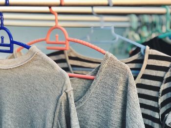 Close-up of clothes hanging on rack