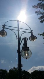 Low angle view of street light against sky