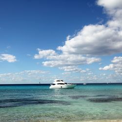 Sailboat in sea against sky