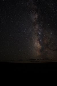 Scenic view of star field against sky at night