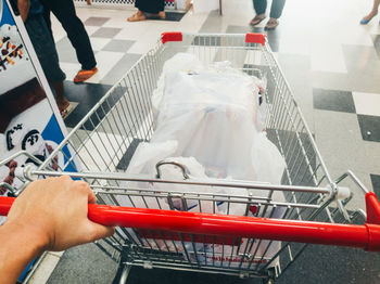 High angle view of woman holding hands at store